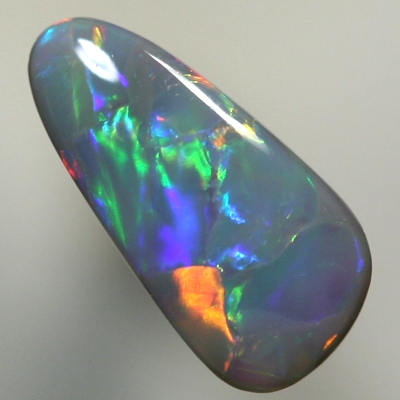 SOLID BLACK OPAL Large rolling flashes, red to gold to green